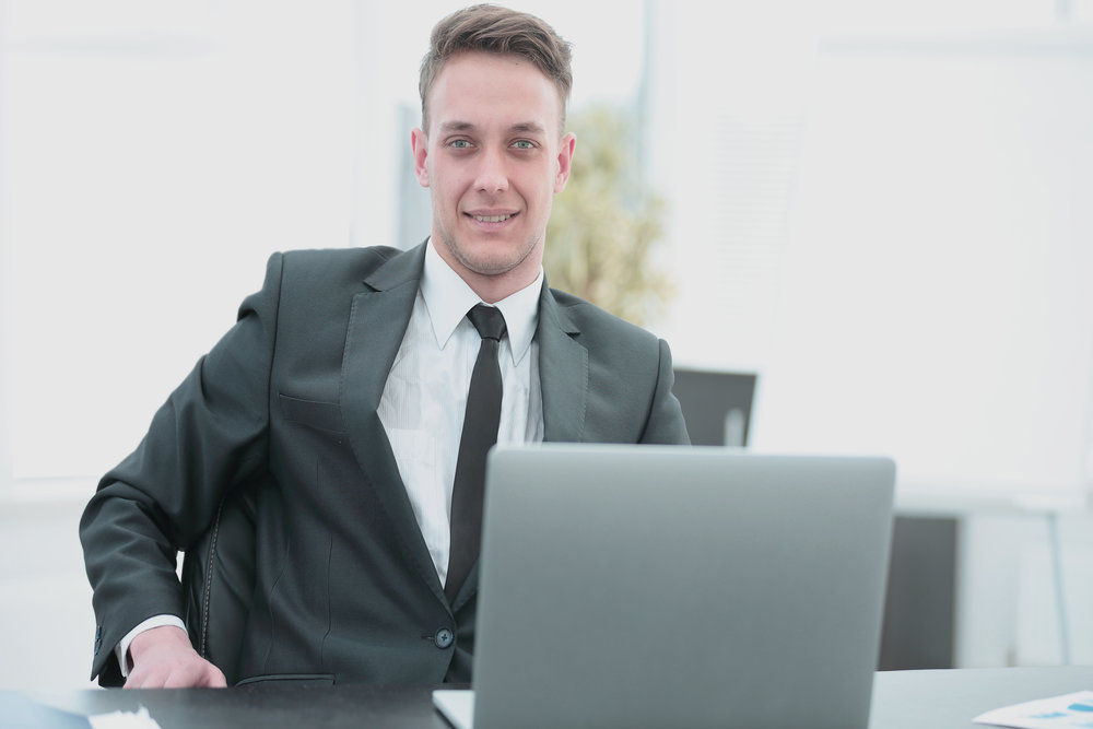 A candidate is sat in front of his laptop, ready for his video interview.